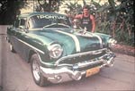 1950s Green Pontiac with swan on hood