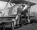 Amelia Earhart by her airplane