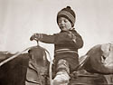 a young colin Low on horse-back
